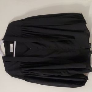 Sheer black blouse with tie detail and v-neck, gently worn